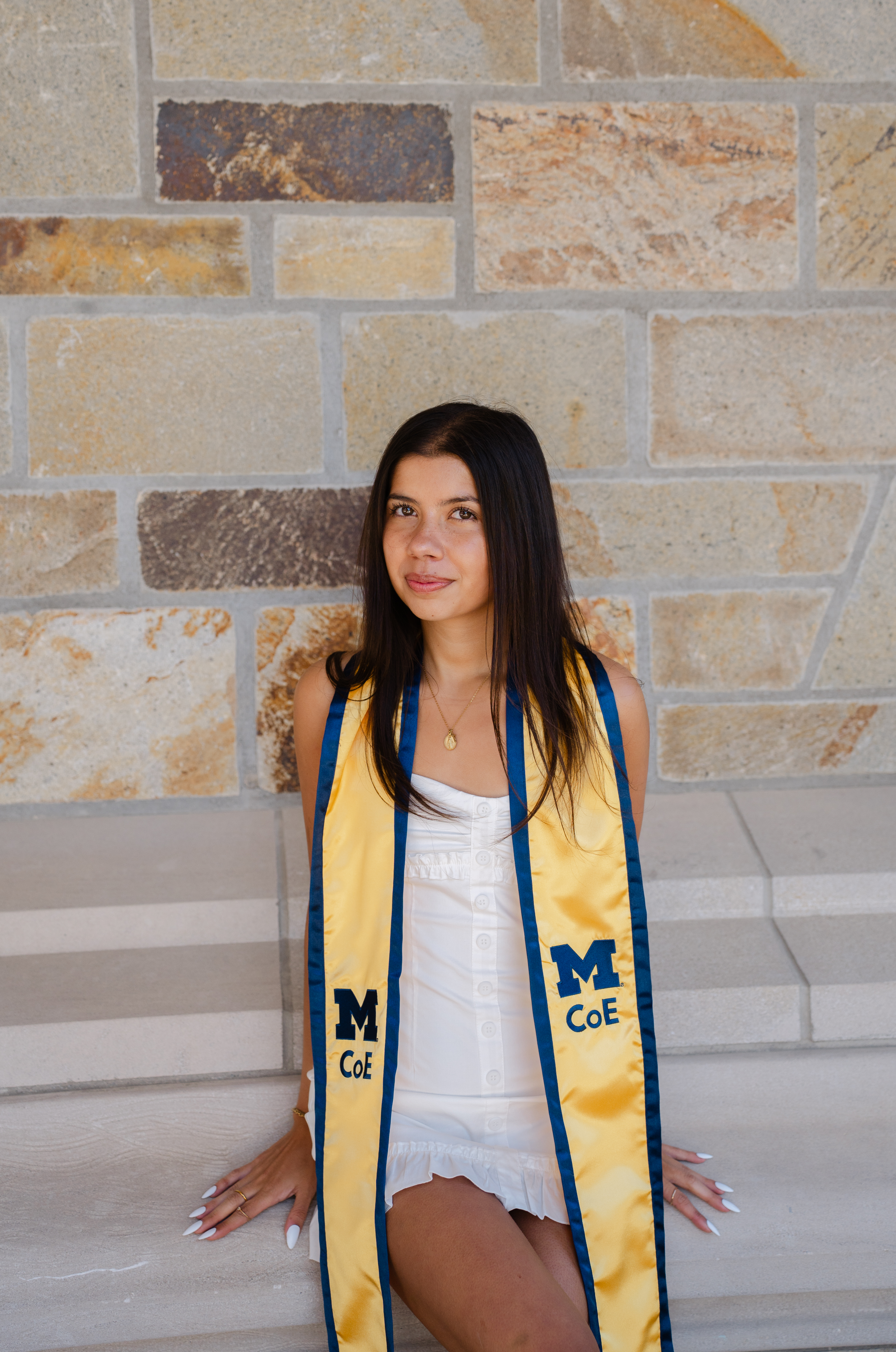 Nicole wearing her University of Michigan graduation stole